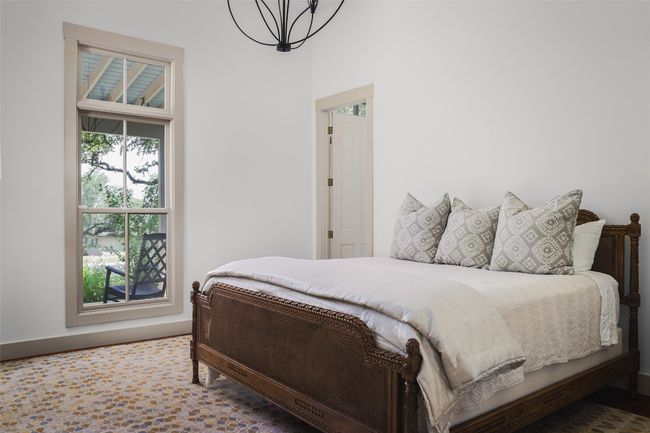 Secondary Bedroom on main level with a chandelier- high ceiling | Image 20