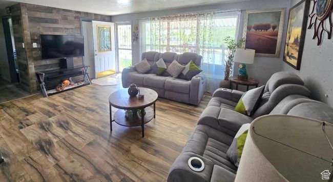 Living area featuring wood finished floors | Image 5