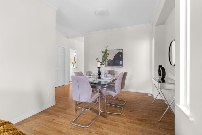 Dining room featuring ornamental molding, wood finished floors, and baseboards | Image 8