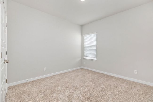 Spare room featuring baseboards and light colored carpet | Image 25