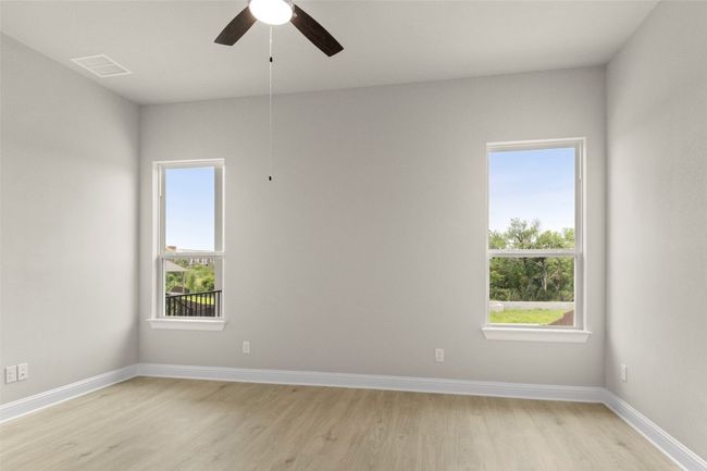 Unfurnished room featuring light wood-style floors, a ceiling fan, and baseboards | Image 24