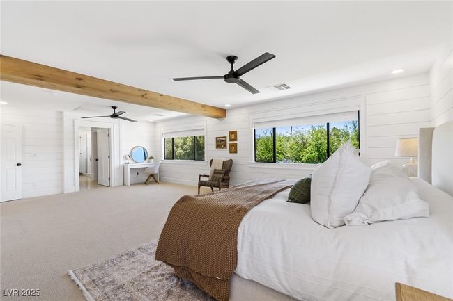 Bedroom with visible vents, carpet flooring, wooden walls, and recessed lighting | Image 25