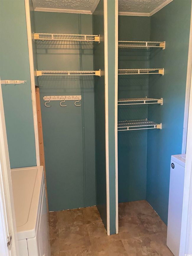 Closet featuring washer / dryer | Image 16
