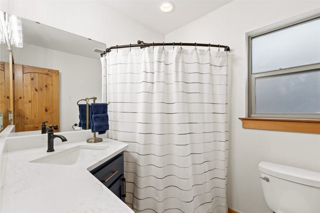 Main Floor Guest Bath Nicely Updated Painted Cabinets, Quartz Countertops, Lovely Hardware & Decorative Lighting. | Image 17