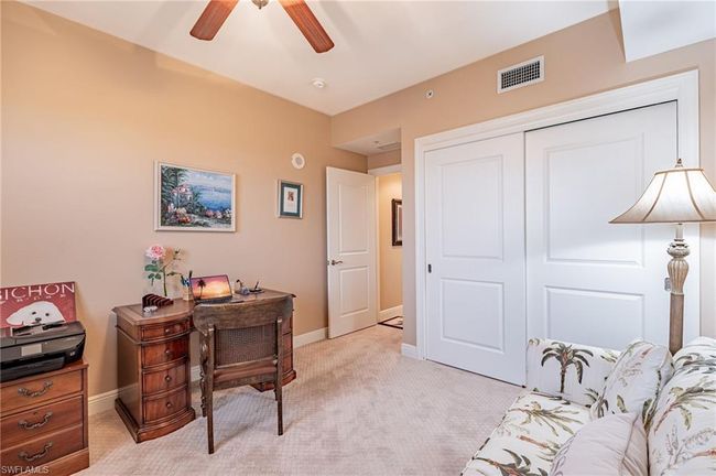 Office space featuring ceiling fan and light colored carpet | Image 37