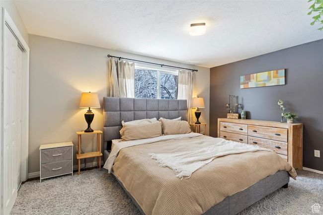 Bedroom featuring carpet flooring, a closet, and baseboards | Image 22