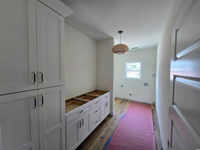 Mudroom featuring dark wood-style floors | Image 18