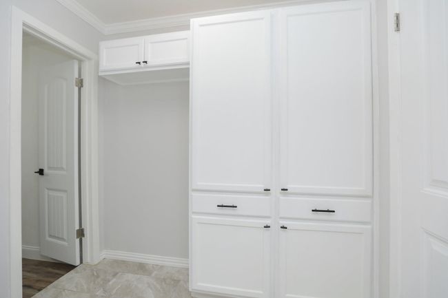 Utility room leading to 3 full bathroom & 4 bedroom/flex space | Image 19