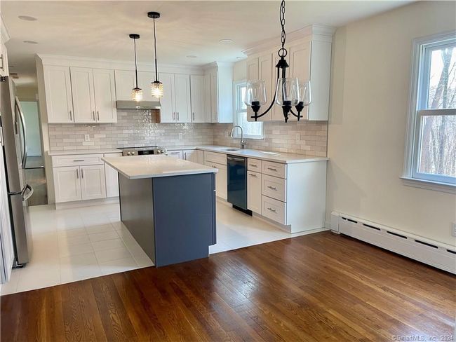 Kitchen looking into hallway | Image 7