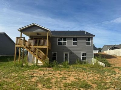 Back of property with ceiling fan and a lawn | Image 3