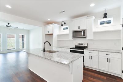 Kitchen example of a completed Toby plan. All plans, pricing and specifications are subject to change without notice. | Image 1