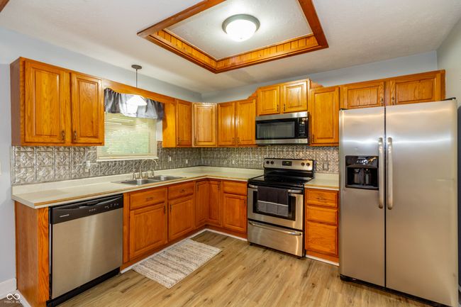 14 x 12 Kitchen just off from garage and dining area. | Image 6