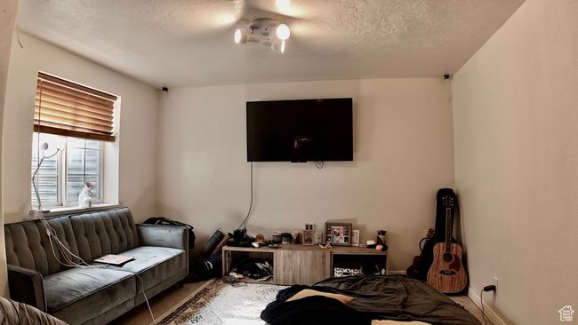 Living area featuring a textured ceiling | Image 60