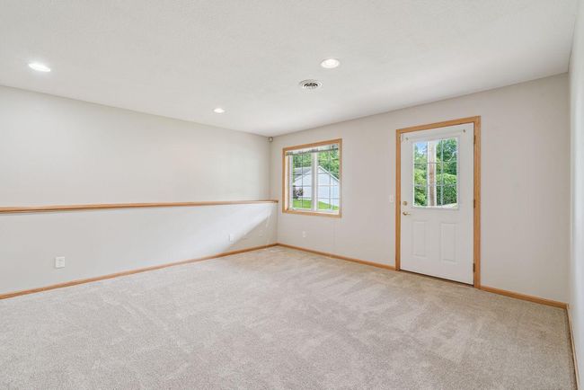 Large (34x13) walkout lower level family room, freshly painted, new carpet, outside leads to back patio, recessed lights. | Image 19