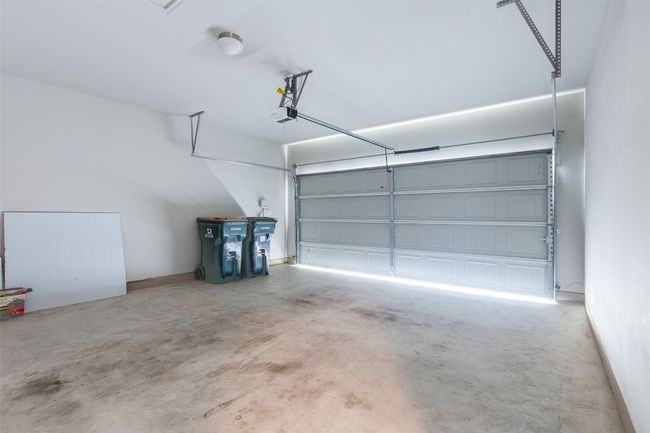 Garage featuring a garage door opener | Image 40