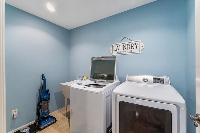 Laundry room equipped with updated washer and dryer, plus large closet is conveniently located next to Primary Suite. | Image 19