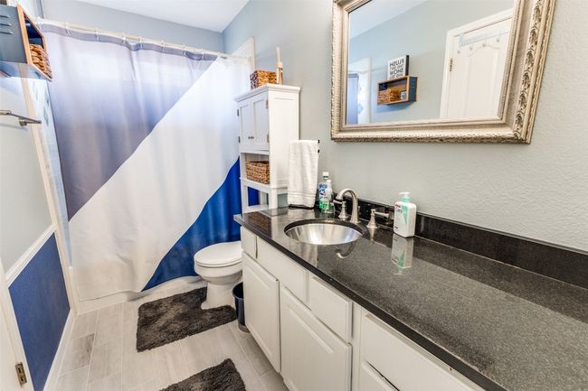 Full bathroom with vanity, toilet, and shower / tub combo | Image 18