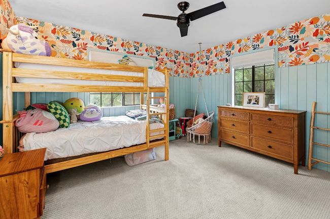 Bedroom featuring wallpapered walls, carpet floors, and ceiling fan | Image 25