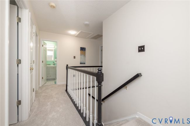 Stairs with carpet floors, attic access, and a textured ceiling | Image 19