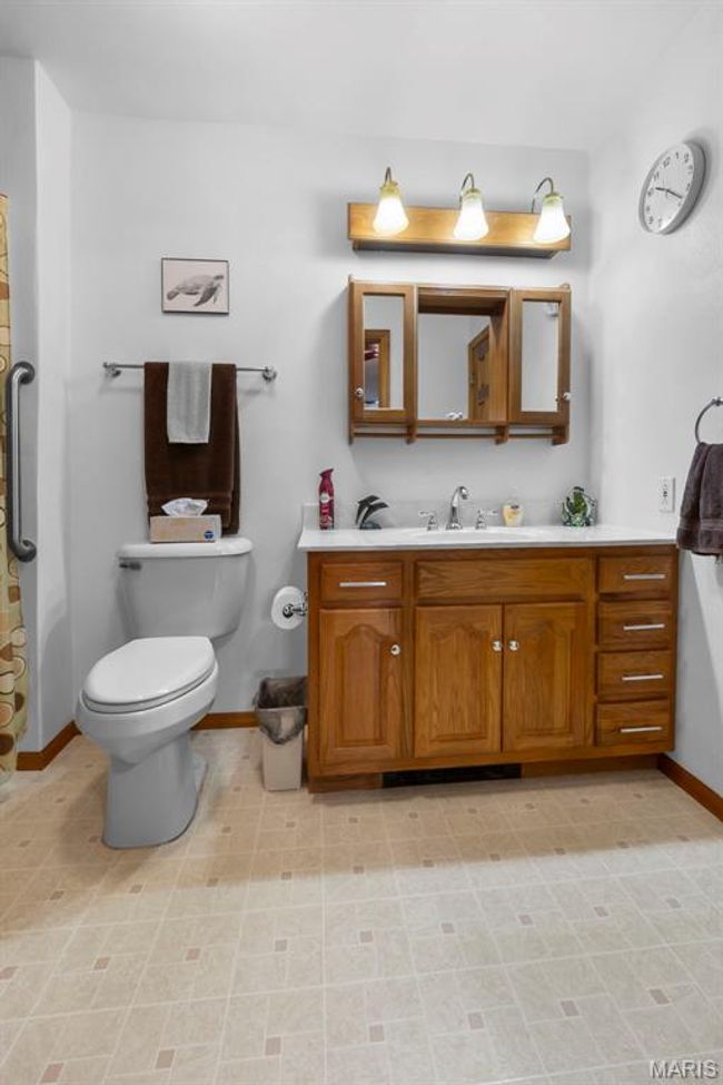 Full bath with baseboards and vanity | Image 74