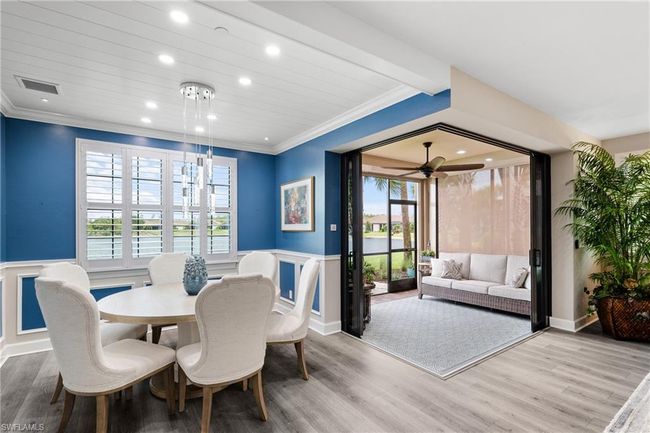 Dining area featuring wainscoting, ornamental molding, light wood-style flooring, recessed lighting, and a ceiling fan | Image 14