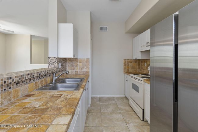 202 - 5693 Star Rush Dr, Condo with 2 bedrooms, 2 bathrooms and null parking in Melbourne FL | Image 14