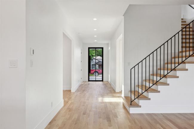 Entrance foyer with light wood-style floors, stairway, and recessed lighting | Image 7