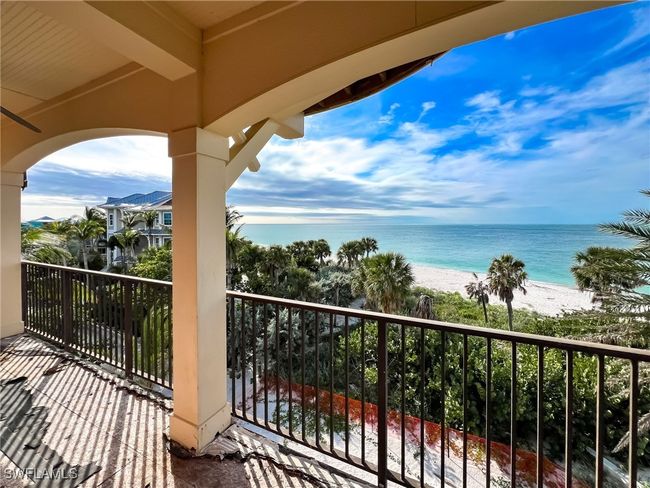 Balcony with a beach view and a water view | Image 29
