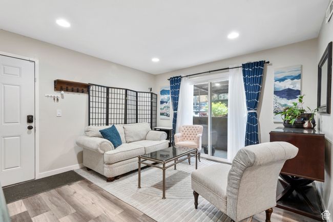 Living area featuring wood finished floors and recessed lighting | Image 9