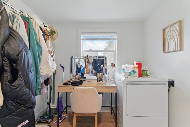 Laundry room featuring separate washer and dryer, wood finished floors, and laundry area | Image 29