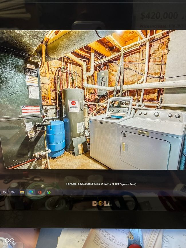 utilities with separate washer and dryer, water heater, electric panel, and heating unit | Image 49