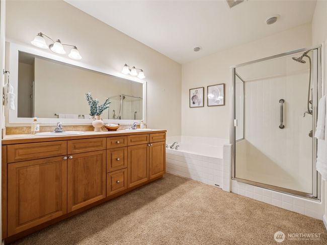 5-piece primary ensuite features double vanity, soaking tub and large rain-head shower. | Image 19