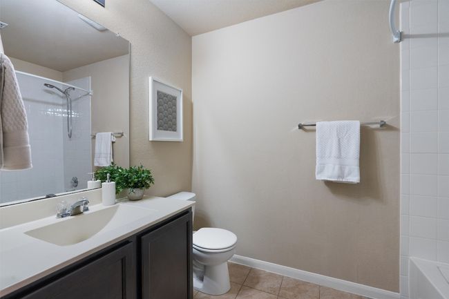 The second full bath is perfectly placed between the secondary bedrooms. | Image 22