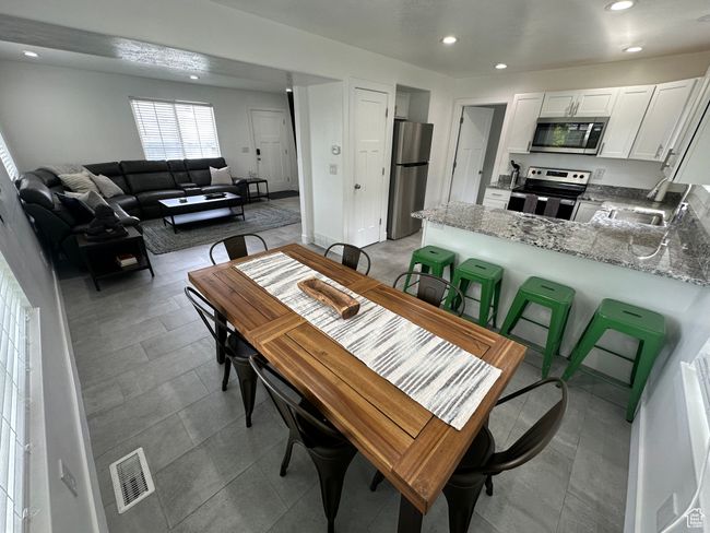 Dining area featuring recessed lighting | Image 16