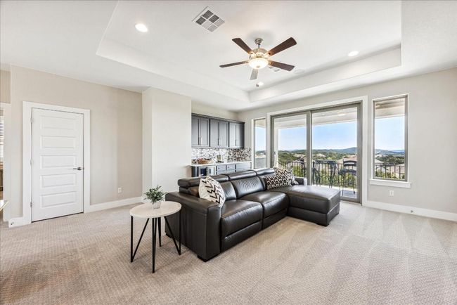 The upstairs game room is a great place to entertain, with built-in surround sound ceiling speakers that pipe music into the space to elevate the vibe. | Image 23
