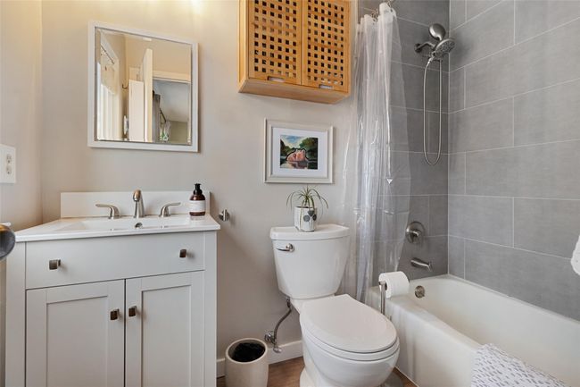 Renovated, primary bathroom with shower/bath combo | Image 13