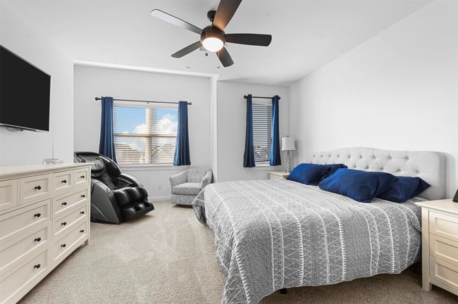 Carpeted bedroom featuring ceiling fan | Image 16