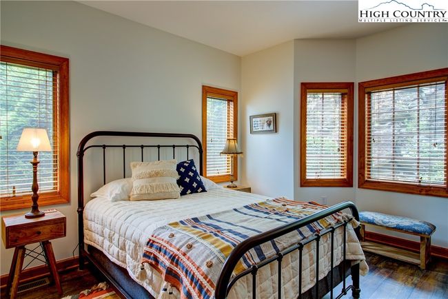 Sunny guest suite is perfectly secluded because the windows open out onto a garden. There is no building in sight. | Image 35