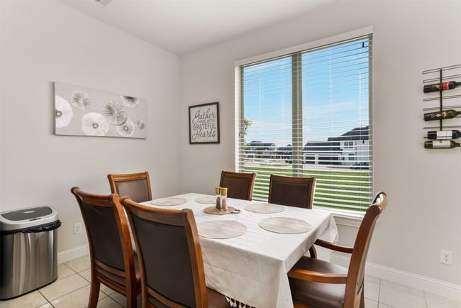 Dining space featuring baseboards and light tile patterned flooring | Image 16