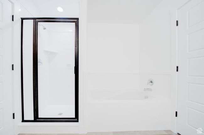 Photo of a similar master bathroom with separate tub and shower | Image 4