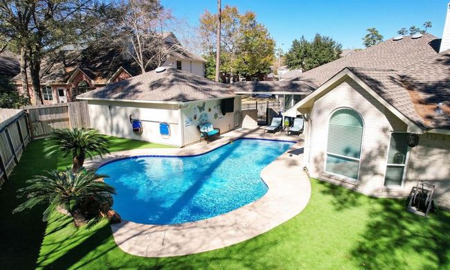 Your outdoor life will be amazing! Friends and family will gravitate to the sparkling pool with waterfall and patio. | Image 6