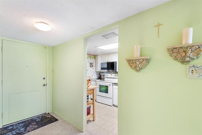 FRONT ENTRY OF UNIT. VIEW INTO KITCHEN | Image 6