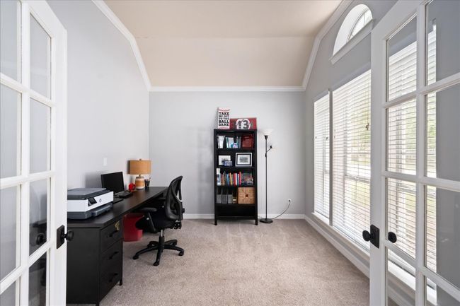 Home office featuring crown molding, French doors and lofted ceiling | Image 7
