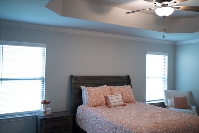 Bedroom with crown molding and a ceiling fan | Image 13