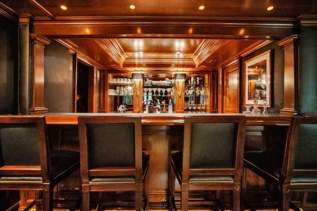 Fantastic bar room w. stone countertops w. designer bar stools, SubZero refrigerator, SubZero wine storage and SubZero ice maker | Image 18