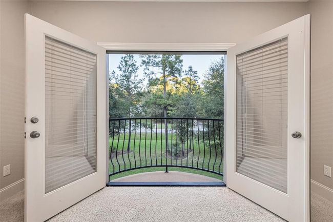 Enjoy serene treetop views from your private upper-level balcony. | Image 33