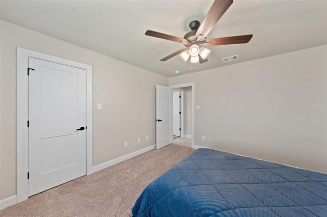 secondary bedroom w/ ceiling fan | Image 23