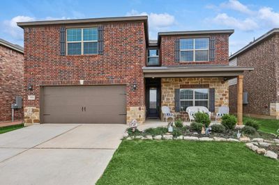 View of front of house with a front yard and a garage | Image 1