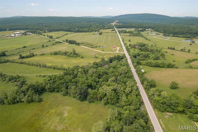 Aerial overview of property's location featuring mountains and rural landscape | Image 46