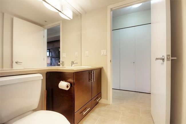 Bathroom with toilet, vanity, and tile patterned floors | Image 20